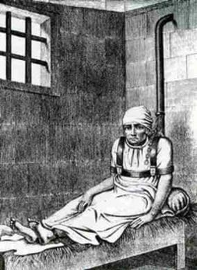 An engraving of a woman restrained in a strait-waistcoat in a barred cell