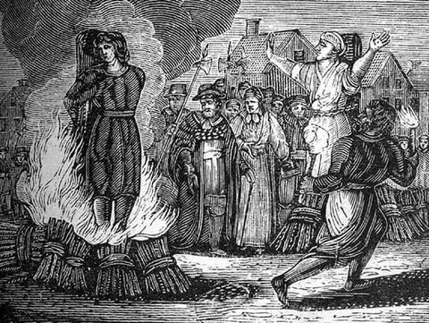 An engraving of a woman being burned at the stake before a crowd